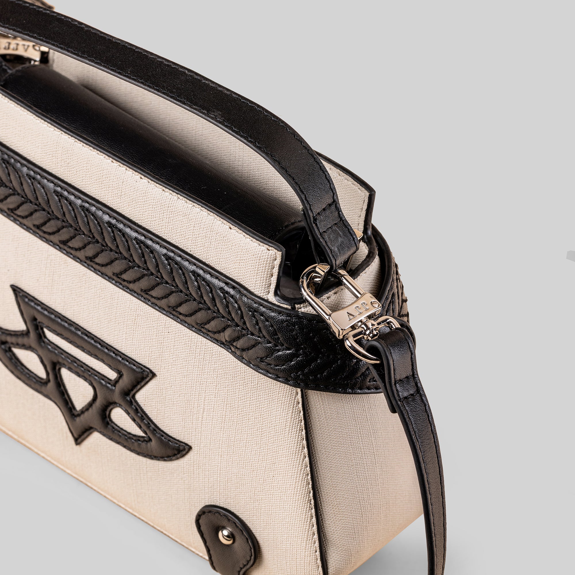 Ivory - Noir Phoenix Top Handle Bag